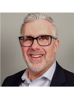 Gary L. Post - RE/MAX Crossroads Properties