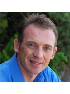 Tim Brim - RE/MAX Realty Unlimited