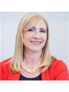 Dora Chacon - RE/MAX Realty Unlimited