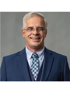 Curtis Skeens - RE/MAX Realty Unlimited