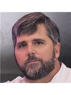 Brett Corrigan - RE/MAX Revolution