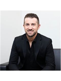 Kyle Kuhns - RE/MAX Revolution