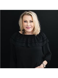 Taryn L. Hebert - RE/MAX ONE