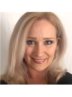 Rebekah Holland - RE/MAX Plaza