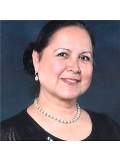 Juanita Flores - RE/MAX 10