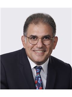 Jim Mneymneh - RE/MAX 2000