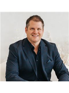 Travis Gordon - RE/MAX Hallmark Realty Group