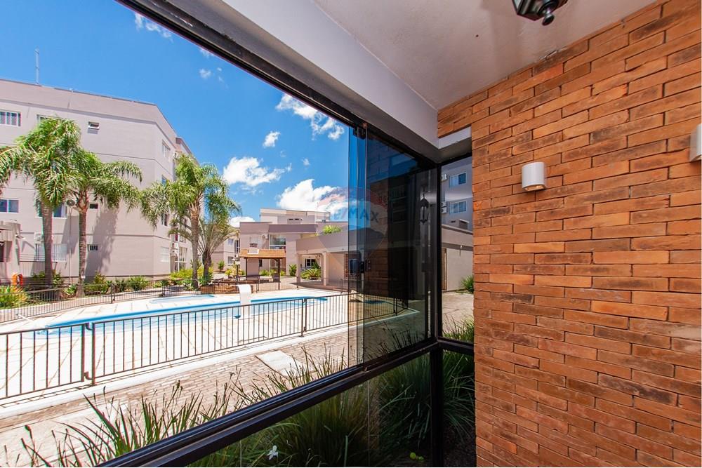 Apartamento - Venda - Montenegro , Rio Grande do Sul - SACADA COM VIDROS FRENTE PISCINA.jpg - Sacada - 610091040-33