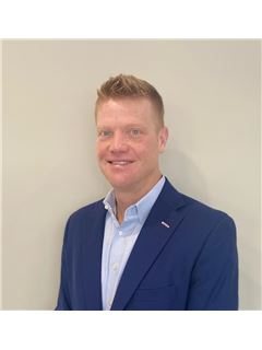 Makelaar - Travis Comstock - RE/MAX OCEANSIDE REALTY